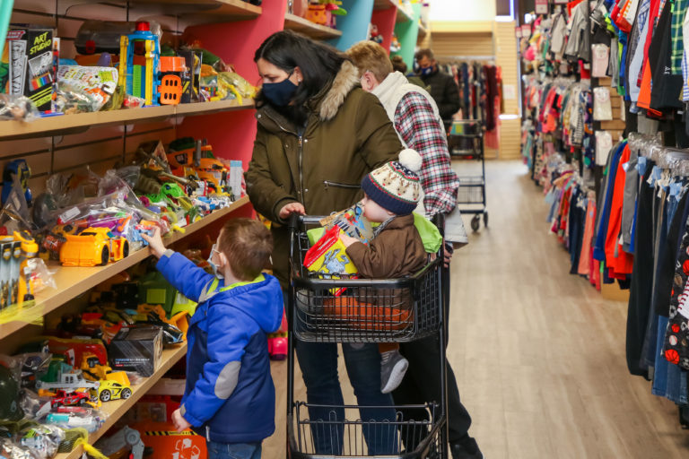 families shopping at a childrens thrift franchise